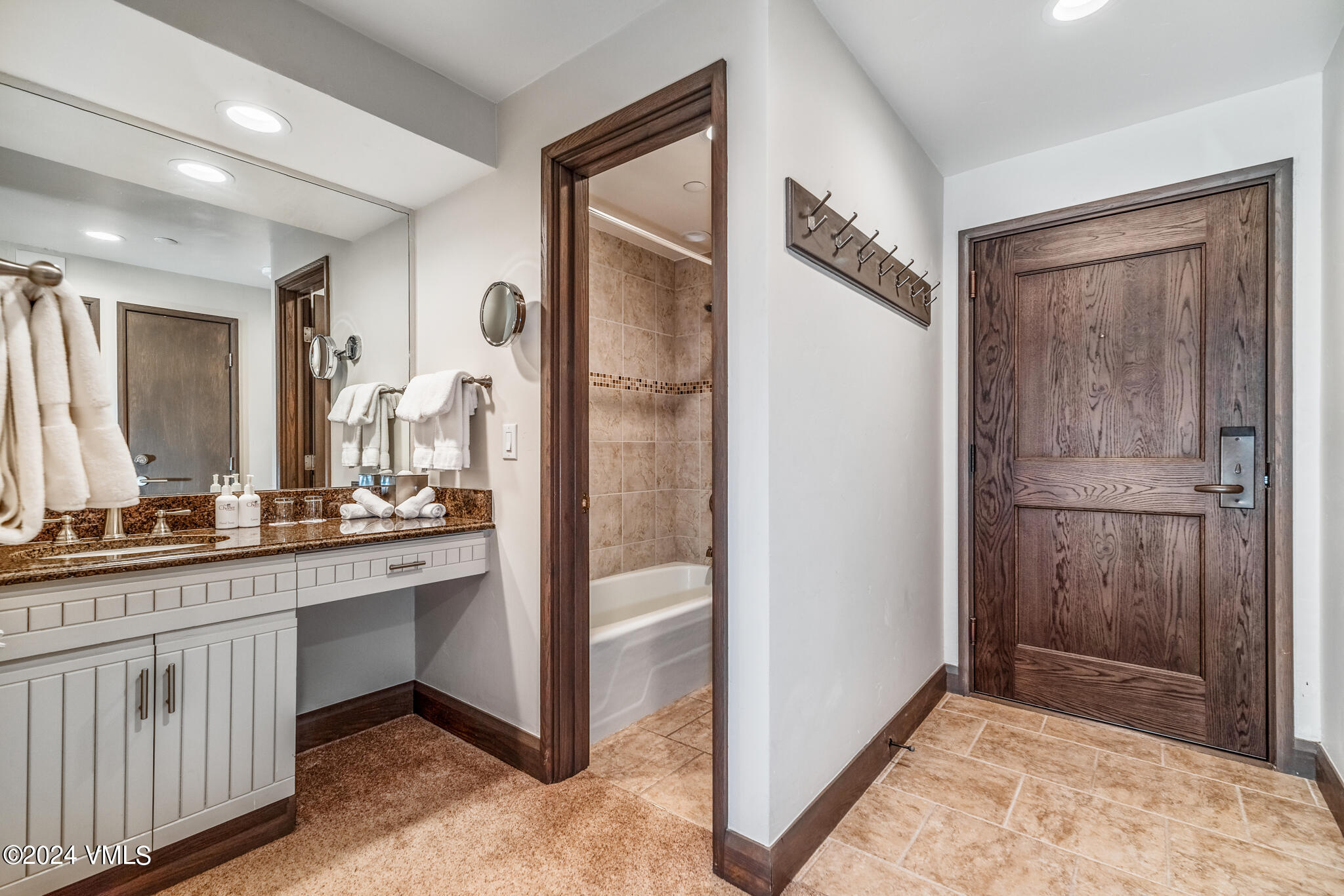 120 Offerson Road, Unit F230 Beaver Creek, CO 81620 - Photo 30 of 48 a bathroom with a double vanity sink a mirror and a shower