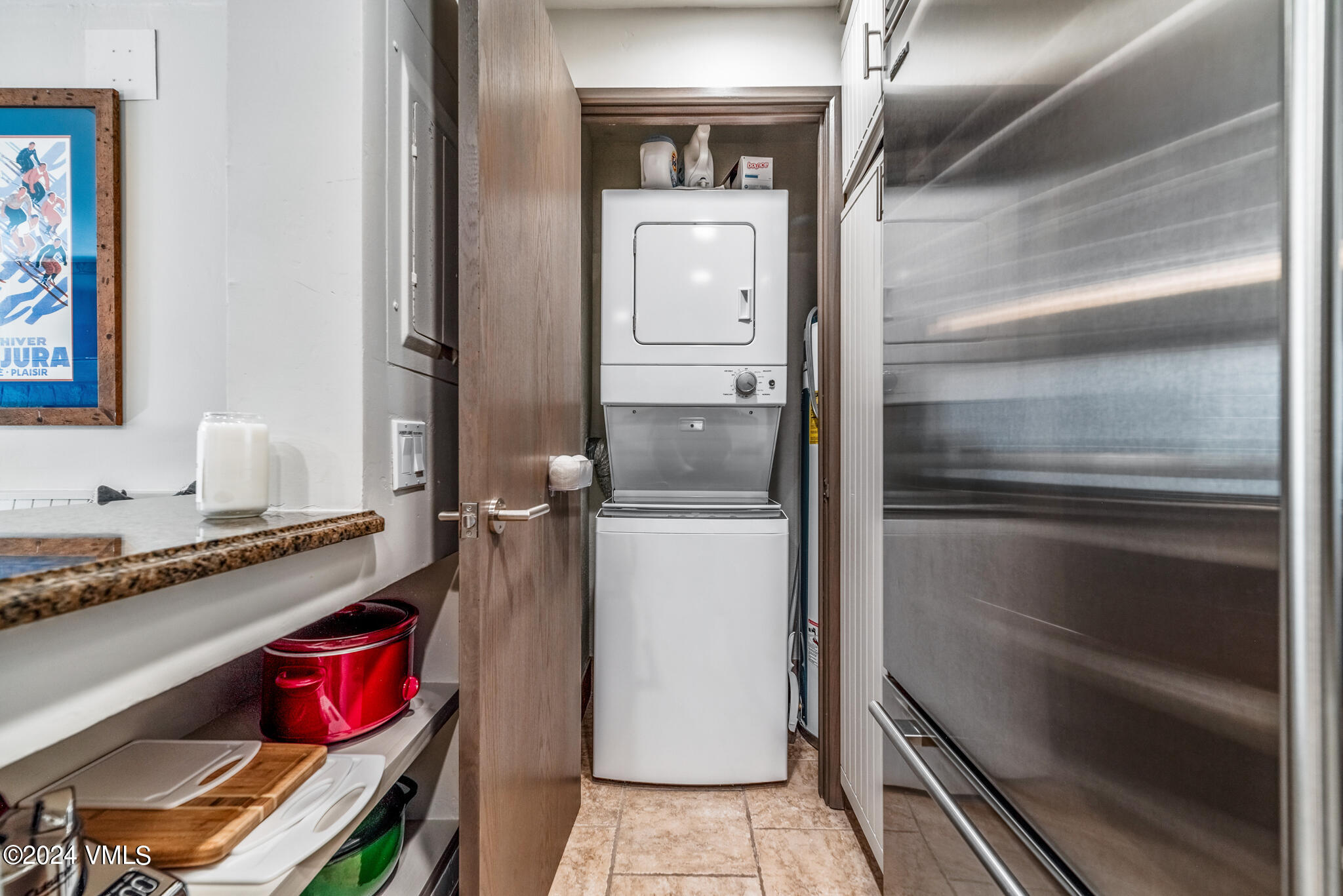 120 Offerson Road, Unit F230 Beaver Creek, CO 81620 - Photo 31 of 48 a kitchen with a refrigerator and cabinets
