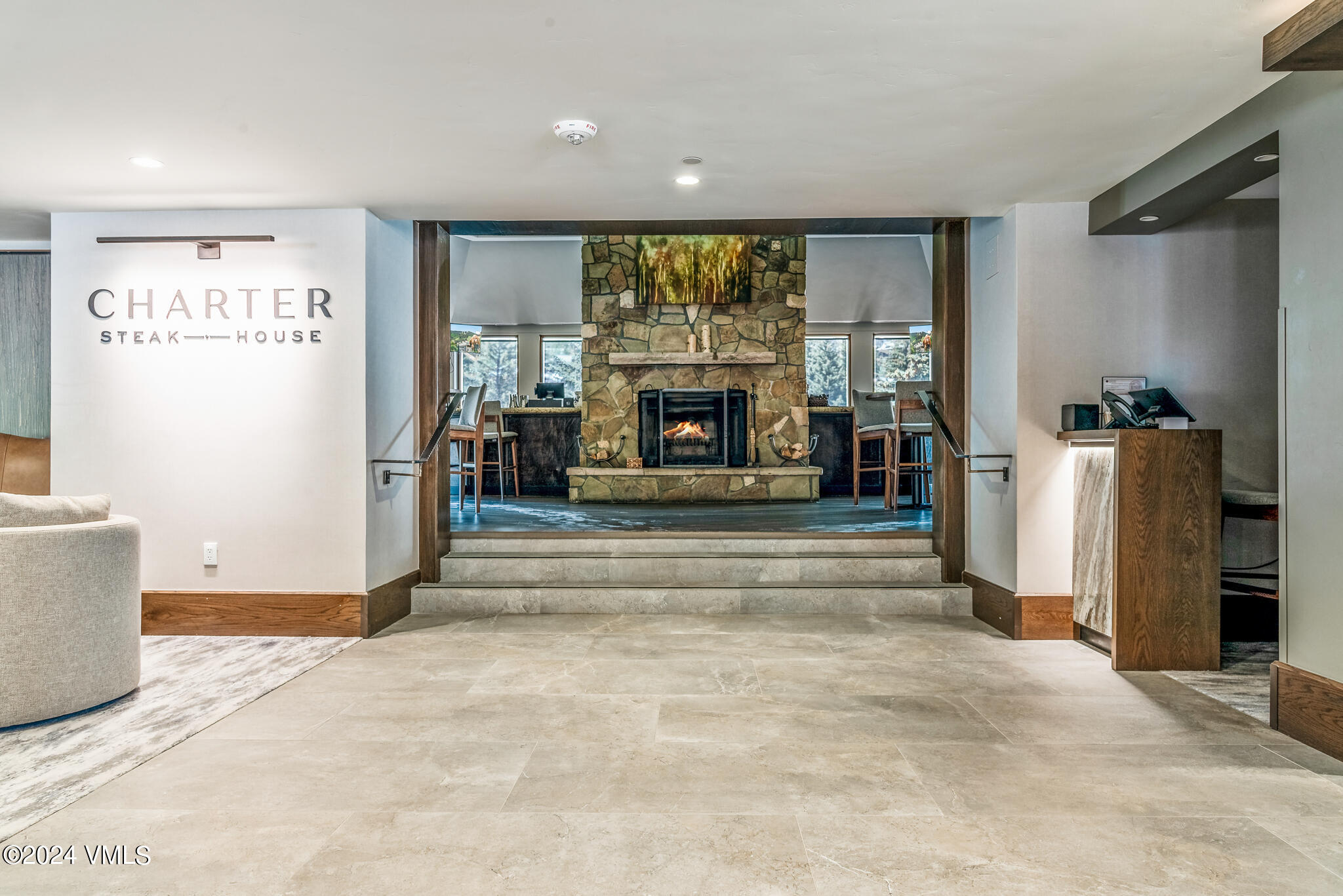 120 Offerson Road, Unit F230 Beaver Creek, CO 81620 - Photo 32 of 48 a living room with a large window and a fireplace