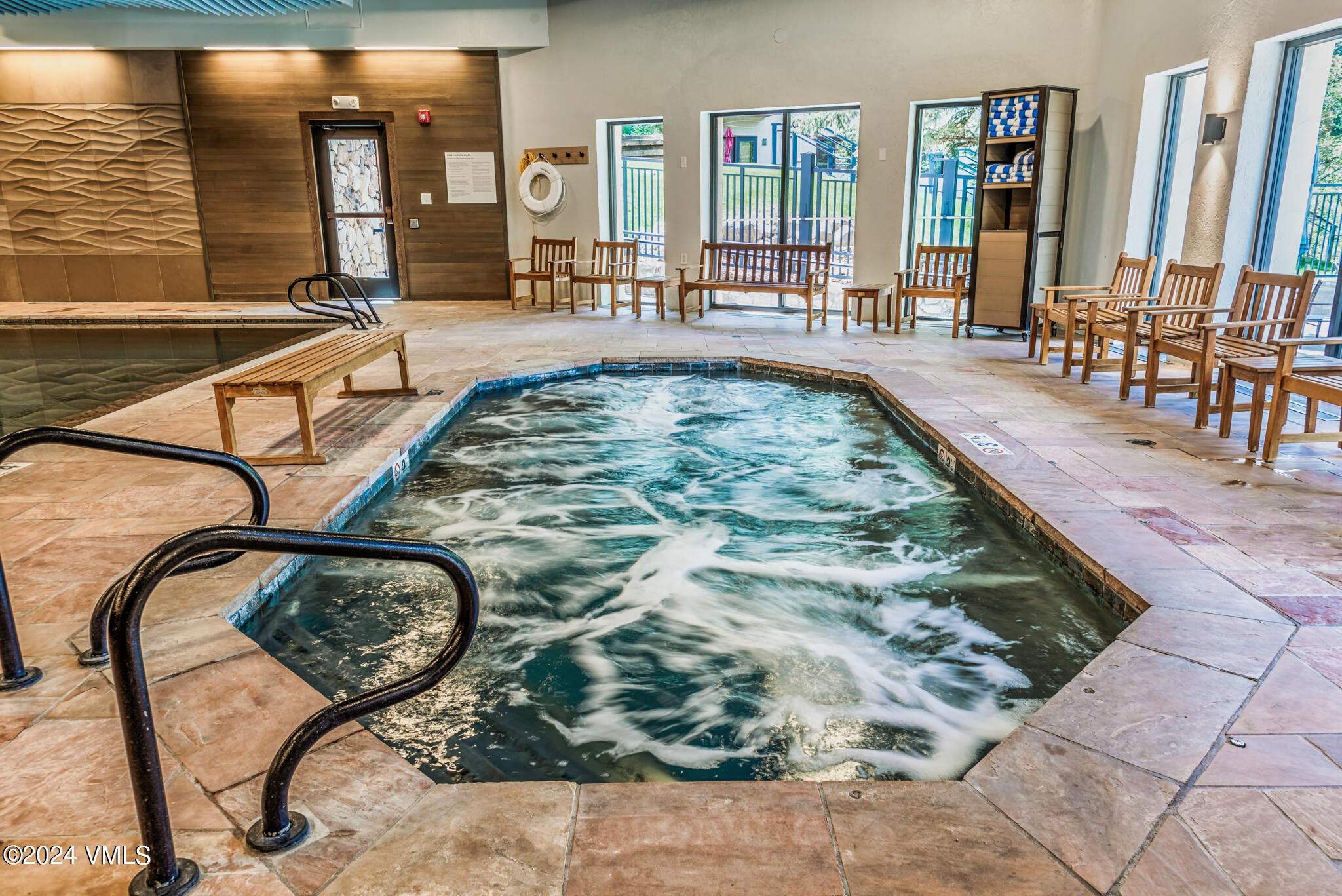 120 Offerson Road, Unit F230 Beaver Creek, CO 81620 - Photo 36 of 48 a view of a swimming pool with outdoor seating