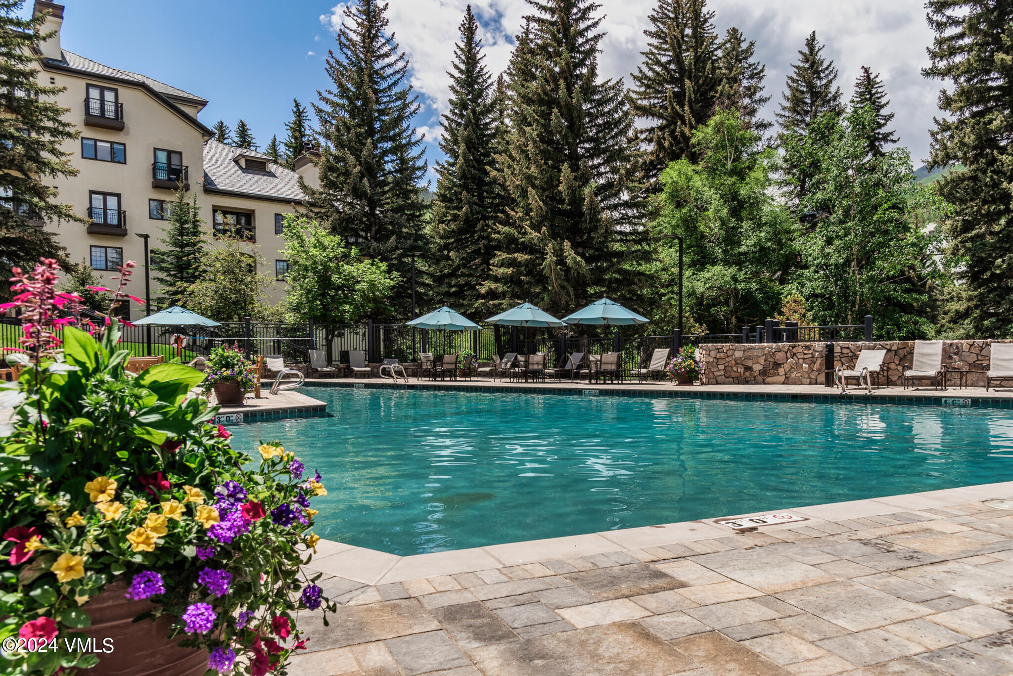 120 Offerson Road, Unit F230 Beaver Creek, CO 81620 - Photo 38 of 48 a view of a house with a yard and sitting area