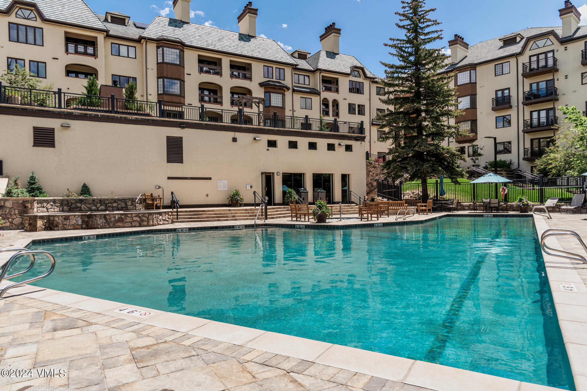 120 Offerson Road, Unit F230 Beaver Creek, CO 81620 - Photo 39 of 48 a swimming pool with outdoor seating and yard
