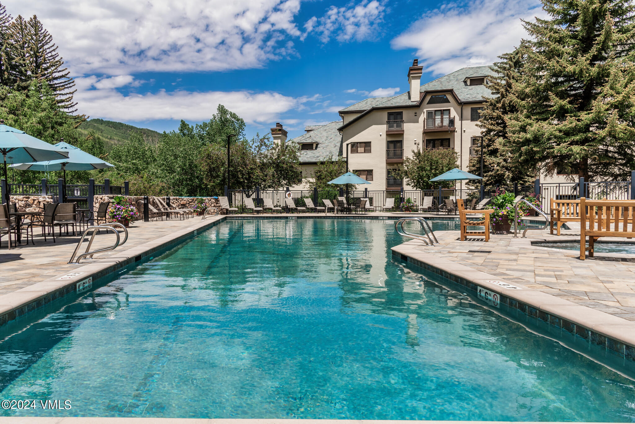 120 Offerson Road, Unit F230 Beaver Creek, CO 81620 - Photo 41 of 48 a view of a lake with a house