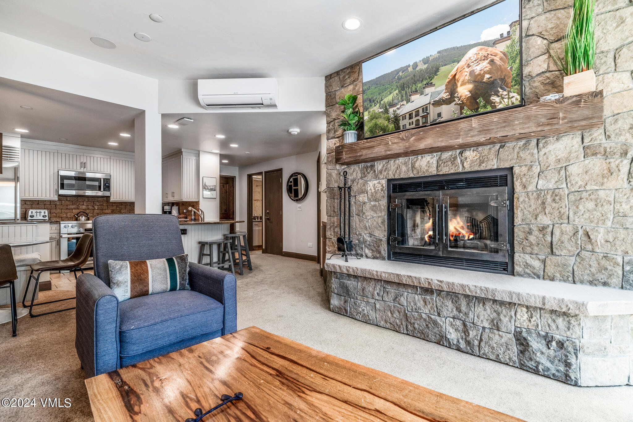 120 Offerson Road, Unit F230 Beaver Creek, CO 81620 - Photo 5 of 48 a living room with furniture and a fireplace