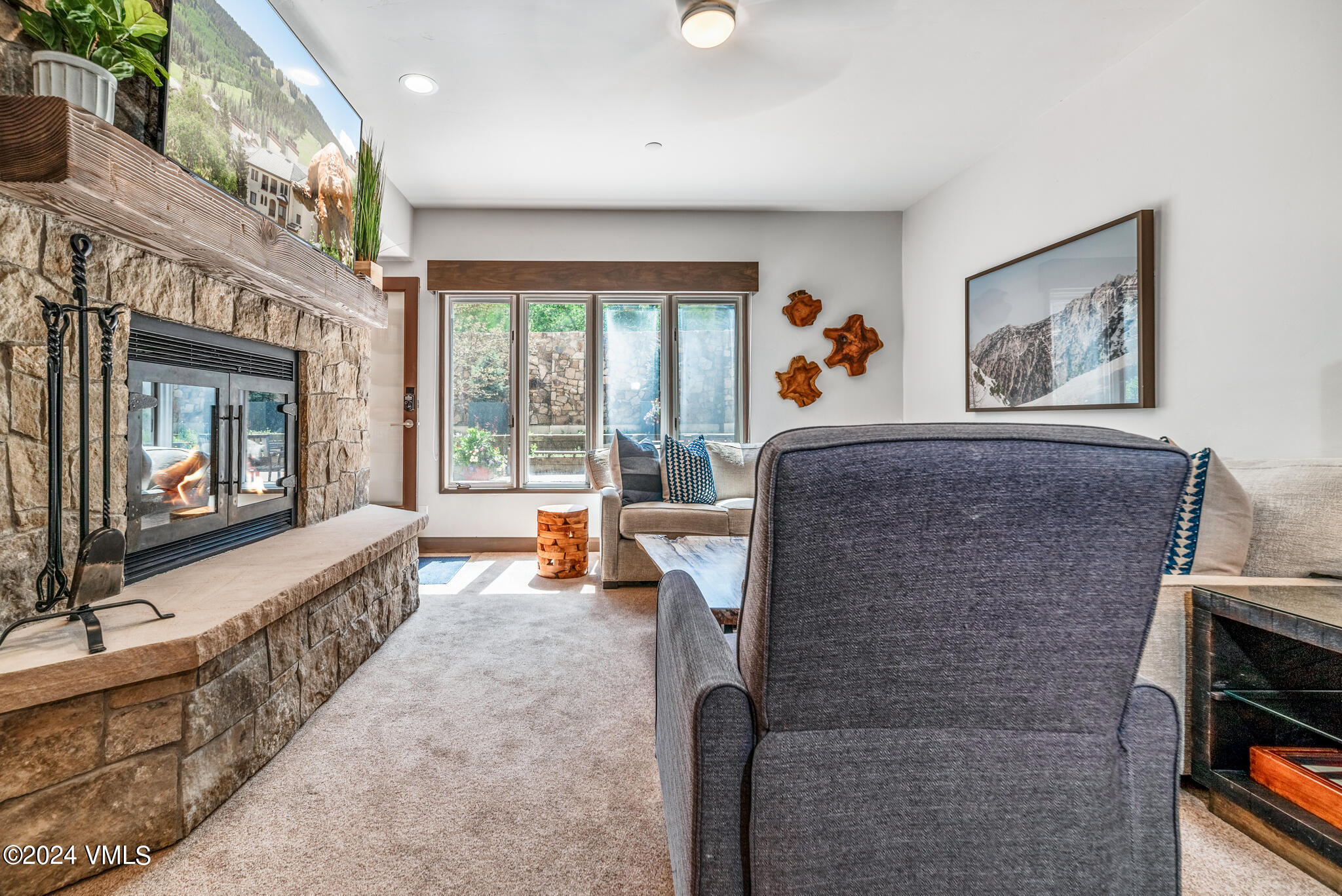 120 Offerson Road, Unit F230 Beaver Creek, CO 81620 - Photo 7 of 48 a living room with furniture and a fireplace