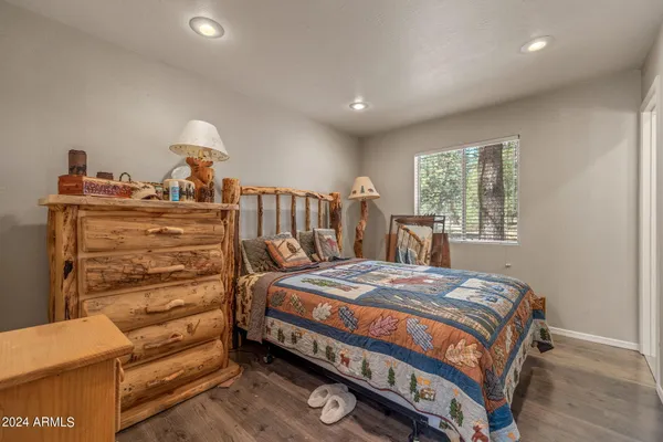 a bedroom with a bed and a dresser