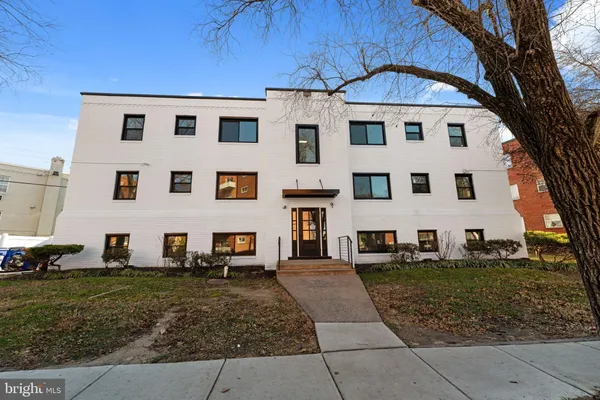 a front view of a building with garden