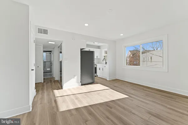 a view of livingroom with hardwood floor and hallway