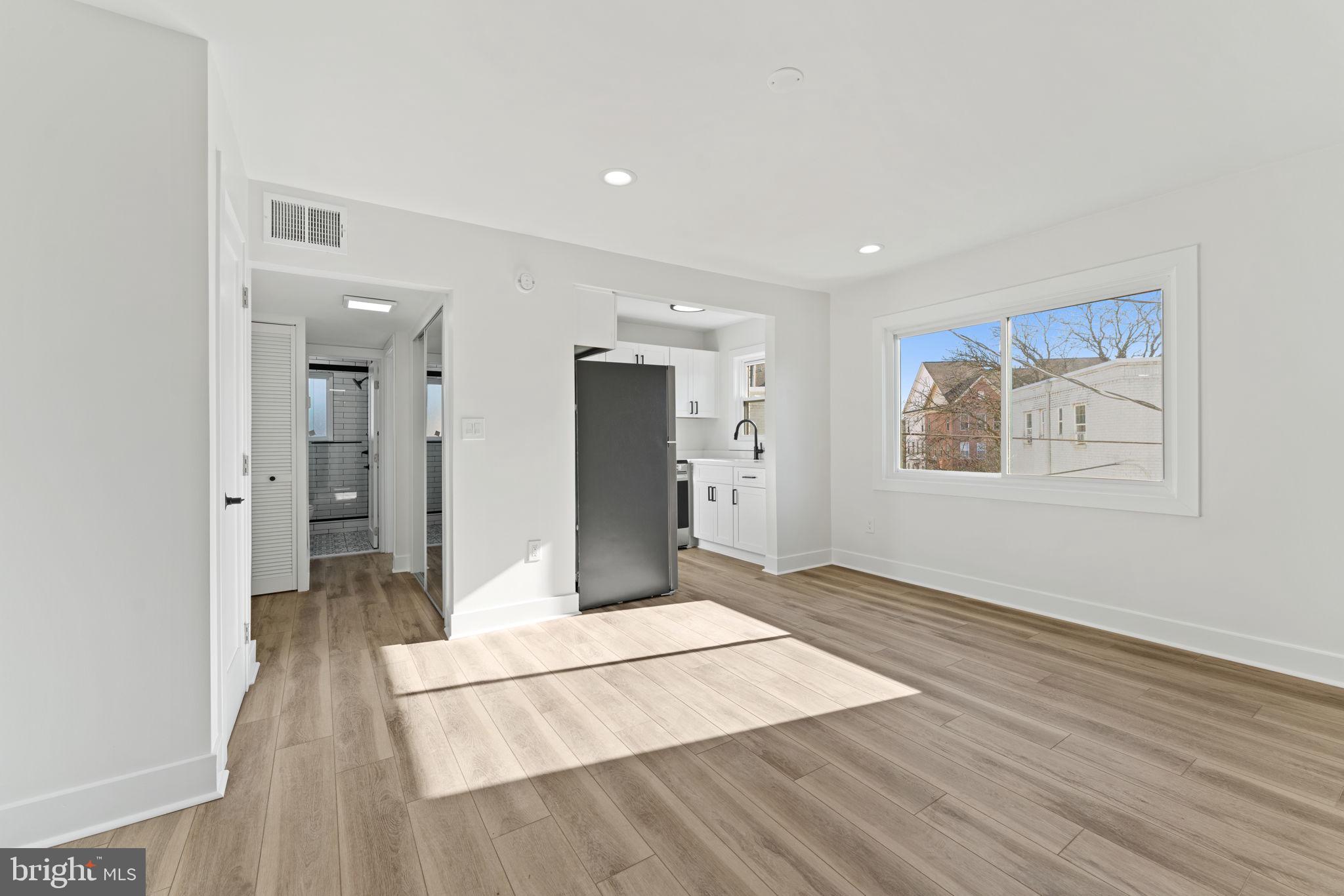 649 Notabene Drive, Unit 6 Alexandria, VA 22305 - Photo 3 of 17 a view of livingroom with hardwood floor and hallway