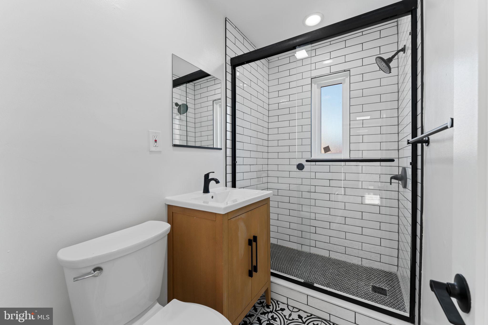 649 Notabene Drive, Unit 6 Alexandria, VA 22305 - Photo 7 of 17 a bathroom with a toilet sink and shower