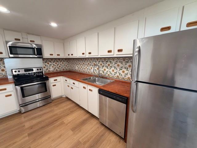 150 Southeast 25th Road, Unit 6A Miami, FL 33129 - Photo 11 of 20 a kitchen with granite countertop a refrigerator and a stove top oven