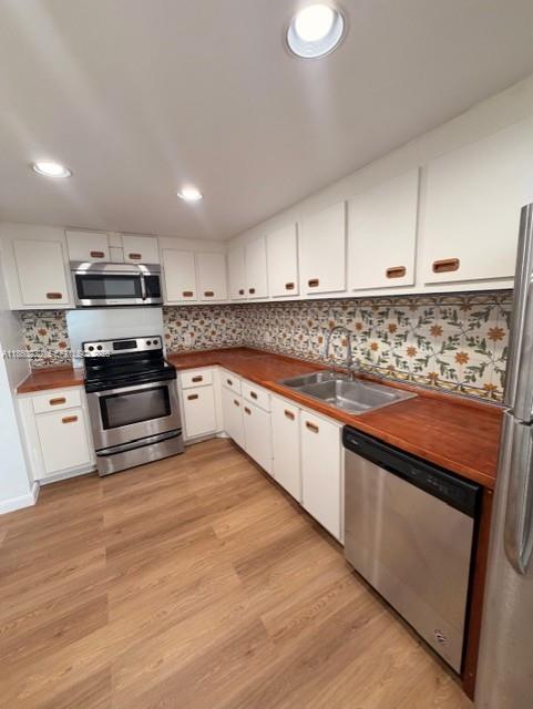 150 Southeast 25th Road, Unit 6A Miami, FL 33129 - Photo 12 of 20 a kitchen with stainless steel appliances granite countertop a stove a sink and a microwave