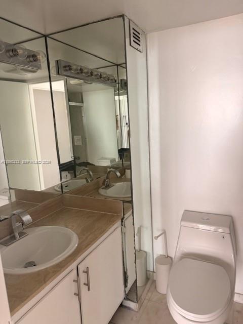 150 Southeast 25th Road, Unit 6A Miami, FL 33129 - Photo 15 of 20 a bathroom with a sink a toilet and shower