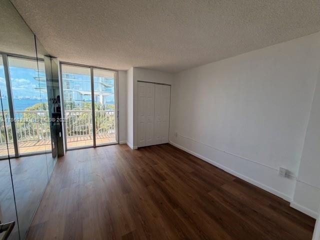 150 Southeast 25th Road, Unit 6A Miami, FL 33129 - Photo 17 of 20 wooden floor in an empty room with a window