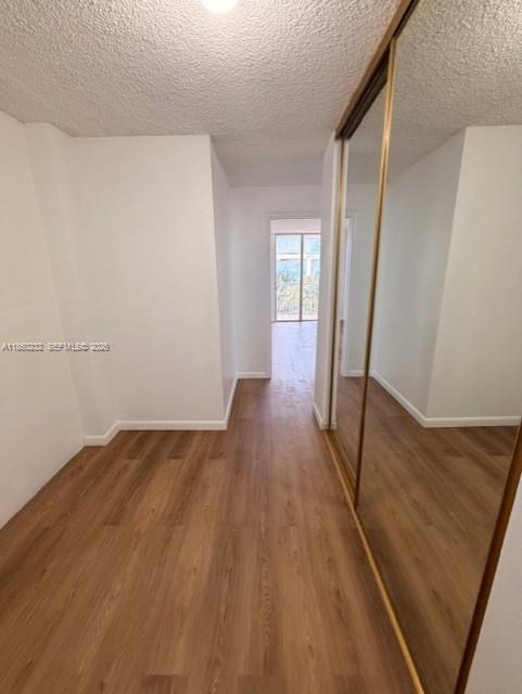 150 Southeast 25th Road, Unit 6A Miami, FL 33129 - Photo 18 of 20 an empty room with wooden floor and windows