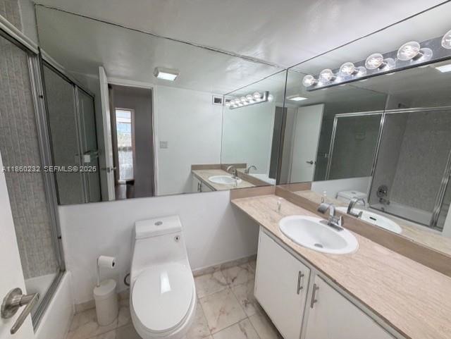150 Southeast 25th Road, Unit 6A Miami, FL 33129 - Photo 20 of 20 a bathroom with a granite countertop toilet sink and mirror