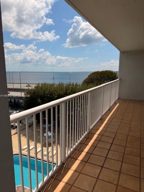 150 Southeast 25th Road, Unit 6A Miami, FL 33129 - Photo 3 of 20 a view of a balcony with wooden floor