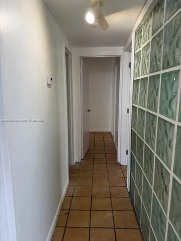 a hallway with wooden floor
