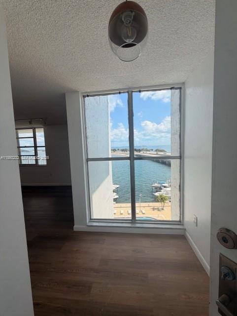 150 Southeast 25th Road, Unit 6A Miami, FL 33129 - Photo 7 of 20 a view of a livingroom with an empty space and a window