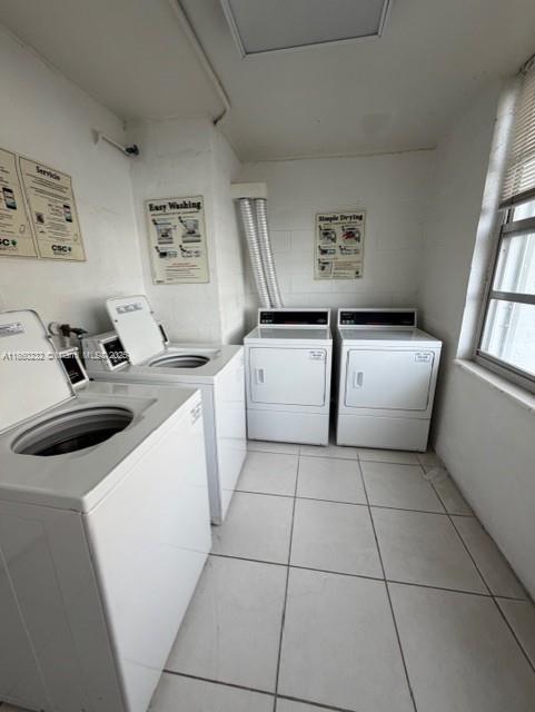 150 Southeast 25th Road, Unit 6A Miami, FL 33129 - Photo 9 of 9 a kitchen with stainless steel appliances a sink a stove top oven a chimney and a window