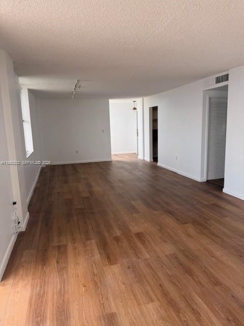 150 Southeast 25th Road, Unit 6A Miami, FL 33129 - Photo 10 of 20 a view of a big room with wooden floor and windows