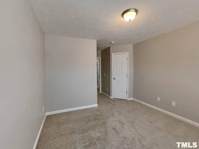 an empty room with an entryway