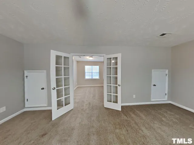 an empty room with windows