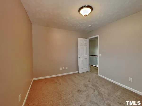 an empty room with a empty space and a window