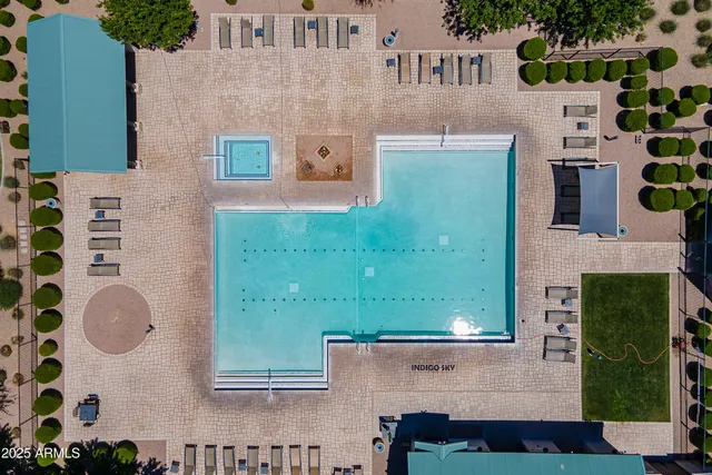 a view of a green field with lots of bushes