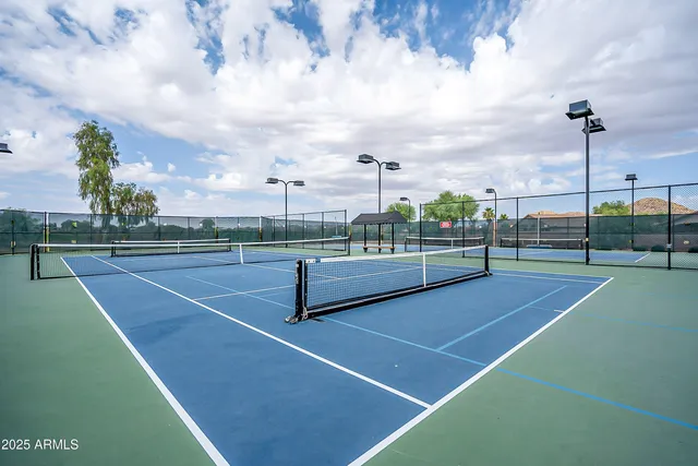 a view of a lake with houses in back