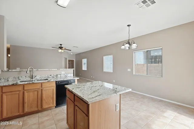 a view of a kitchen counter space and sink