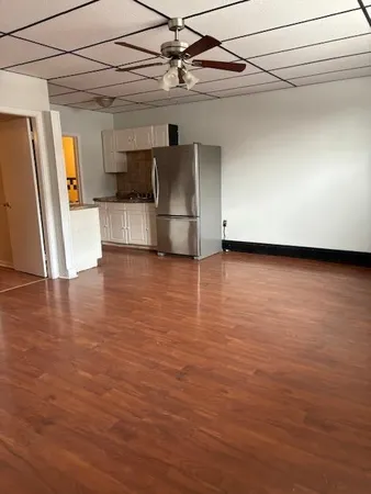a view of a livingroom with wooden floor