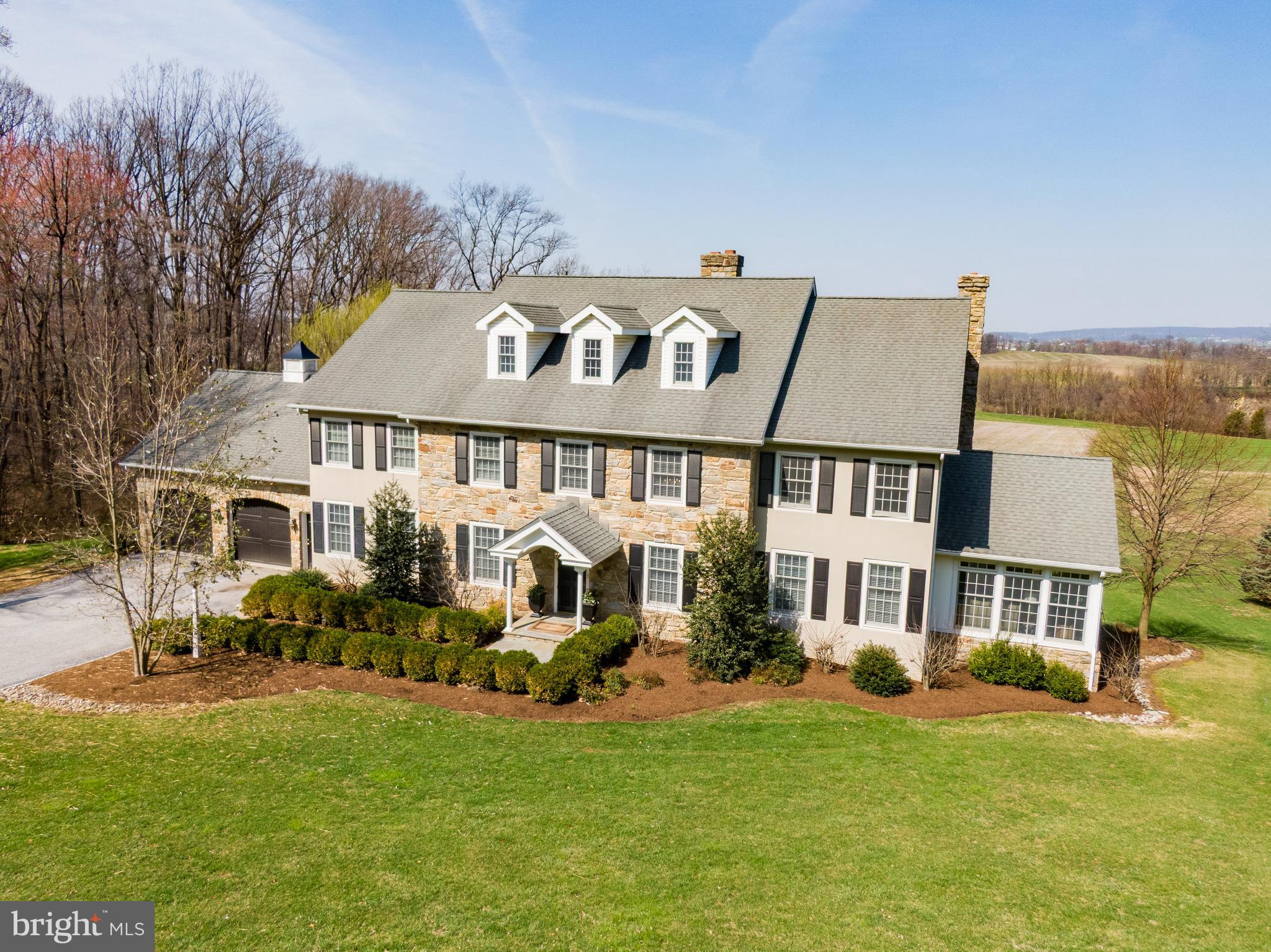 6058 Buena Vista Road Gap, PA 17527 - Photo 113 of 118 a front view of a house with a garden and plants