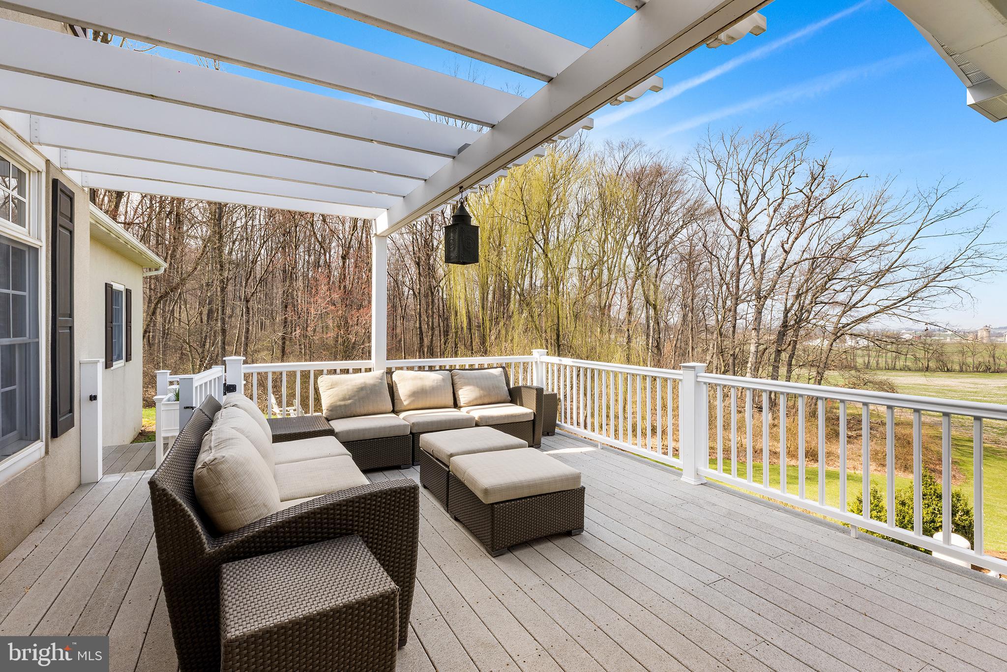 6058 Buena Vista Road Gap, PA 17527 - Photo 37 of 118 a balcony with wooden floor and furniture