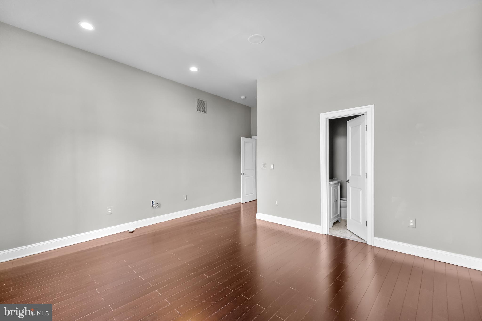 151 V Street Northwest, Unit 4 Washington, DC 20001 - Photo 40 of 49 a view of an empty room with wooden floor
