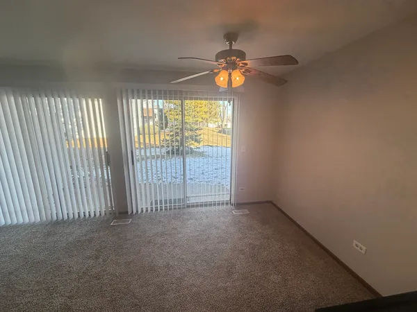 an empty room with windows and outdoor space
