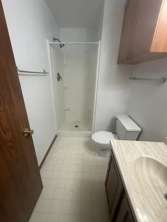 a bathroom with a sink and shower