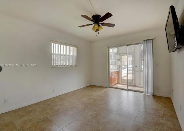 a view of an empty room with a window
