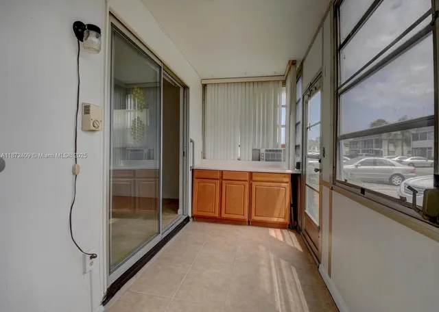 a bathroom with a shower and a sink