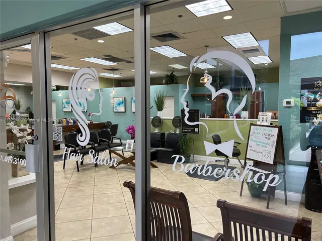 a room with lots of furniture and view of living room