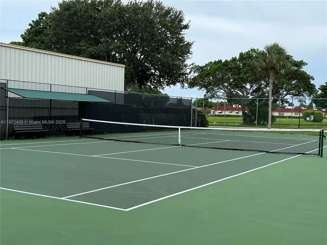 a view of an outdoor space and tennis court