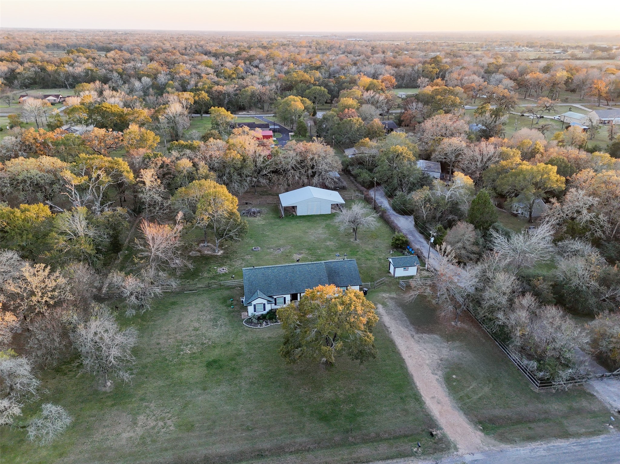 118 Pin Oak Lane Hempstead, TX 77445 - Photo 2 of 33 Aerial view highlighting the home’s setting among mature trees with wide open space and privacy.