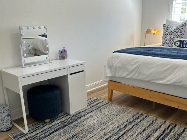 a bedroom with a bed and a fireplace