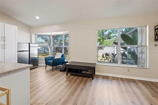 a living room with furniture and a window