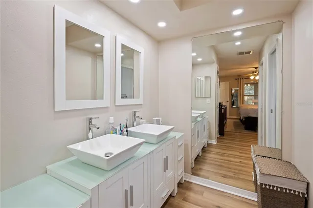 a bathroom with sink and mirror