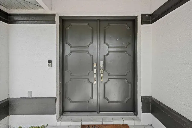 a bathroom with a glass shower door