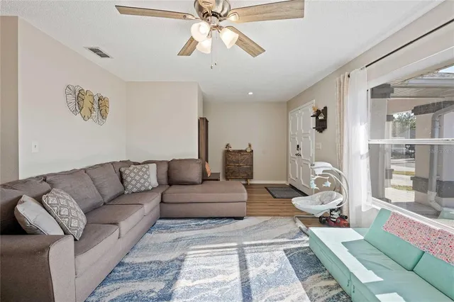 a living room with furniture and a rug