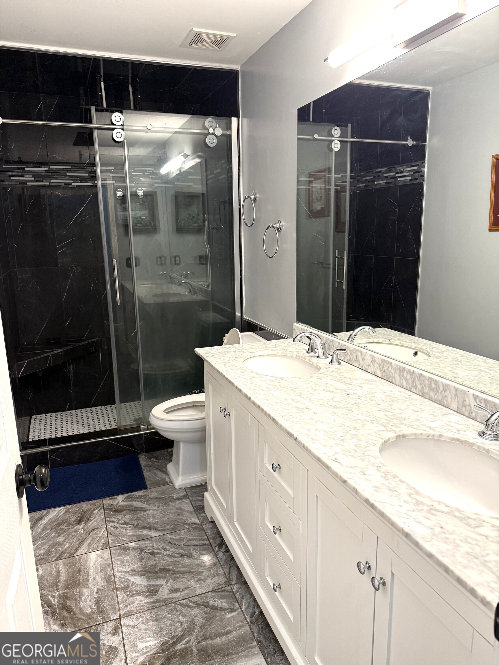 725 Musgrove Road Griffin, GA 30223 - Photo 30 of 52 a bathroom with a sink a toilet and shower