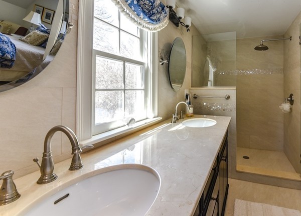 11 Alden Road Wellesley, MA 02481 - Photo 19 of 29 a bathroom with a granite countertop sink a mirror and shower