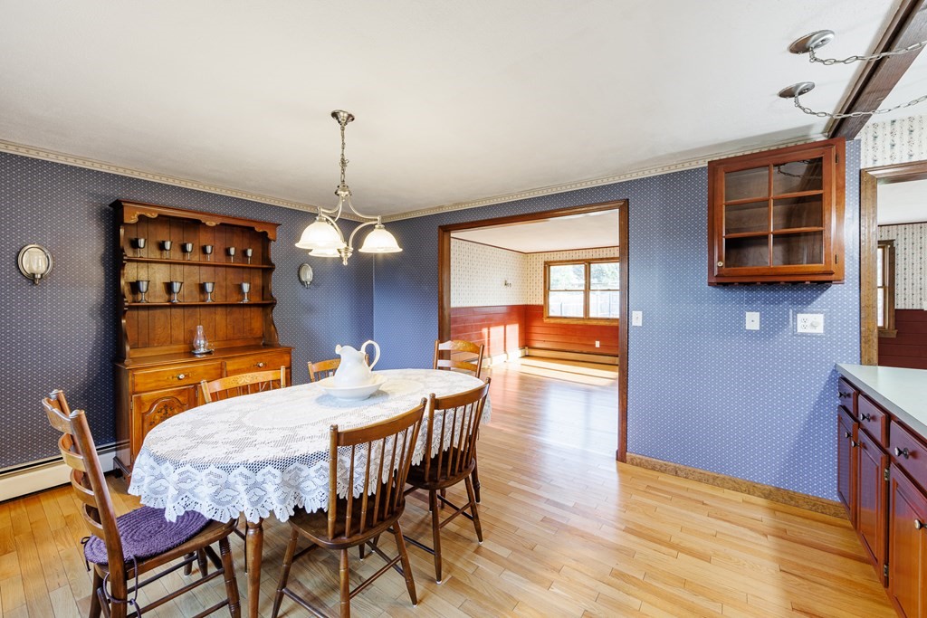 2 Lee Road Groveland, MA 01834 - Photo 20 of 41 a view of a dining room with furniture wooden floor and chandelier